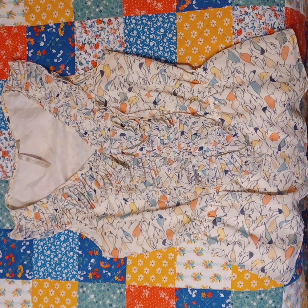 LC LAUREN CONRAD ruffled chest, no sleeve blouse. Bird print. Good condition